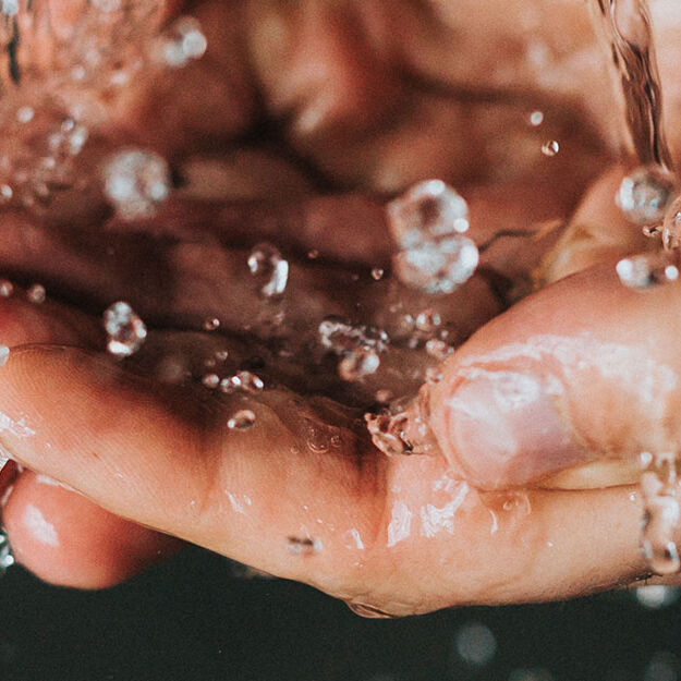 water splashing on hands water splashing on hands