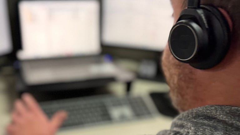 man on a headset providing support man on a headset providing support